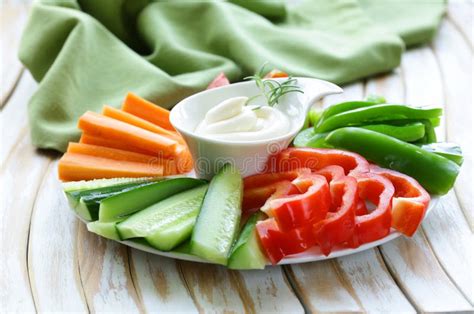 Fresh Vegetables Snack Carrots Cucumbers And Tomatoes With Dip Stock