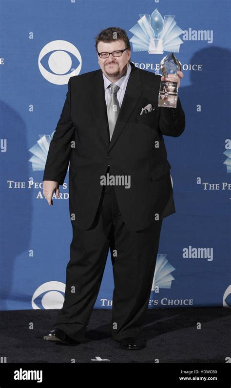 Michael Moore with his award at the People's Choice Awards in Pasadena ...