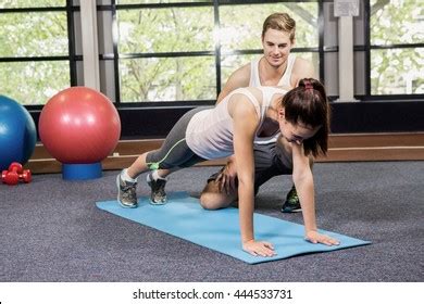 Trainer Assisting Woman Push Ups Gym Stock Photo Shutterstock