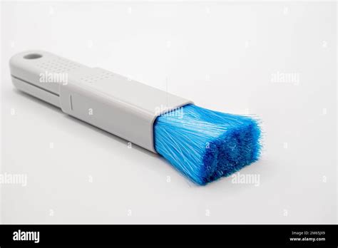 Close Up Of A Plastic Extending Pc And It Dush Brush With Blue Nylon