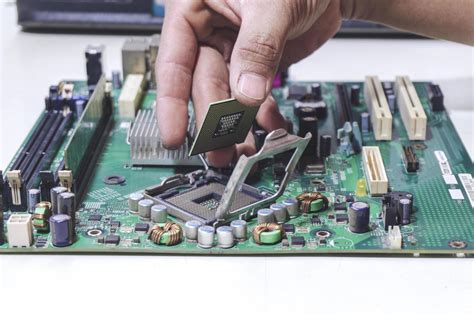 Technician Hand Holding The Cpu For Fixing And Upgrade Computer Pc To