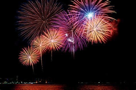 Amazing Beautiful Colorful Fireworks Display On Celebration Night Showing On The Sea Beach With