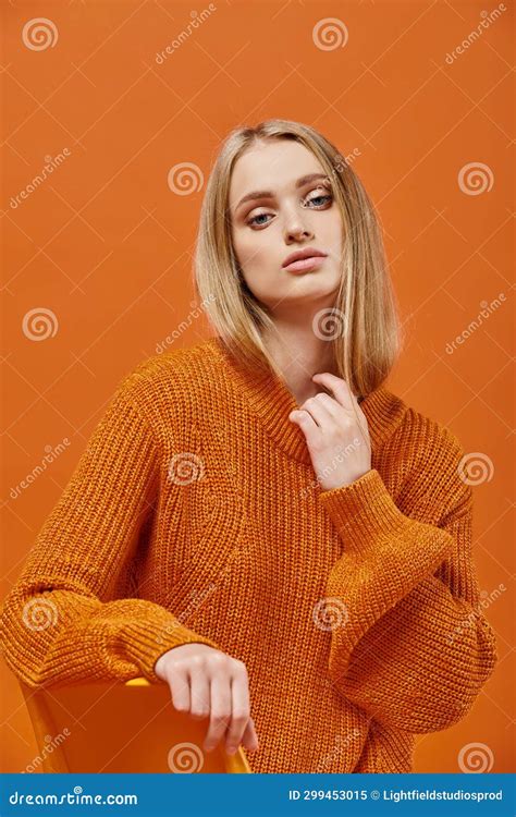 Sophisticated Blonde Woman In Orange Sweater Stock Image Image Of