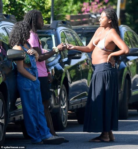 Exclusive Sasha Obama Models Very Skimpy Bikini Top As She Puffs