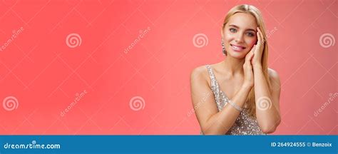 Tender Feminine Gentle Blond Woman In Silver Stylish Dress Touching Face Lovely Smiling Camera