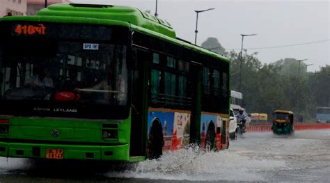 Watch People Cars Wade Through Flooded Streets As Heavy Rain Lashes Delhi Delhi News The