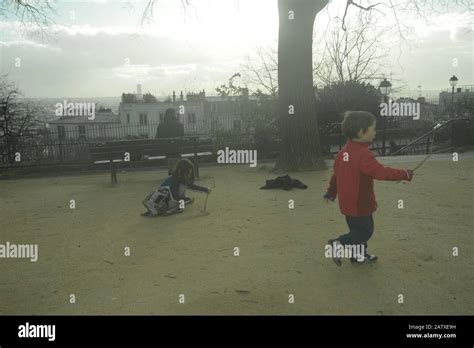 Children playing in a park in Paris, pasakdek Stock Photo - Alamy