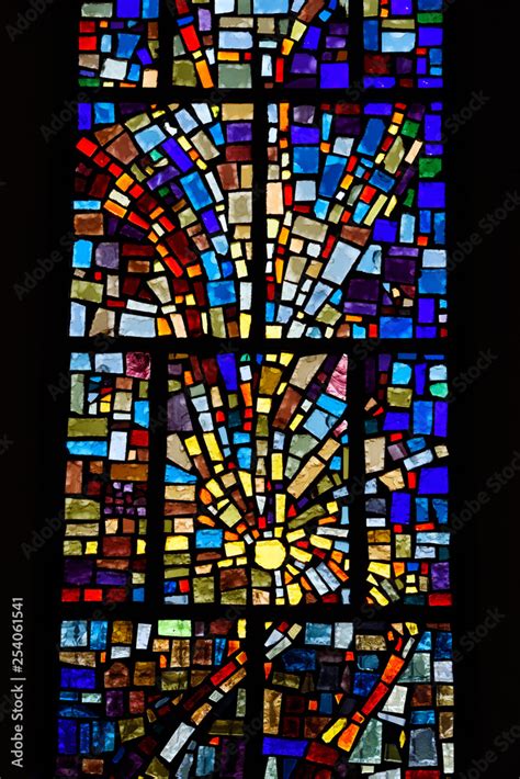 Abstract Multicolor Sun Pattern Of A Stained Glass Window Mosaic In A