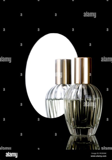 Elegant Clear Glass Perfume Bottle On A Shiny Black Background With