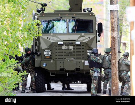 The State Police Swat Team Has Guns Drawn During A Police Standoff With