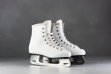 Premium Photo White Ice Skates On Gray Background