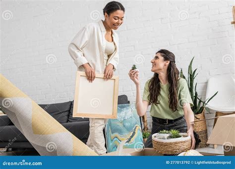 Cheerful Lesbian Woman Showing Tiny Green Stock Photo Image Of Pretty Carton
