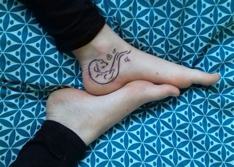 Swimming otter tattoo | Otter tattoo, Tattoos, Paw print tattoo