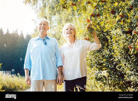 Mature Woman And Man Having A Summer Walk In The Countryside Stock Photo Alamy