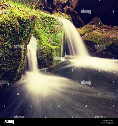 Cascade On Small Mountain Stream Cold Crystal Water Is Falling Over