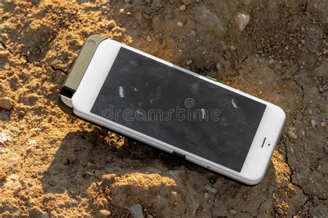 Lost White Smartphone On The Ground Forgotten Mobile Phone On The