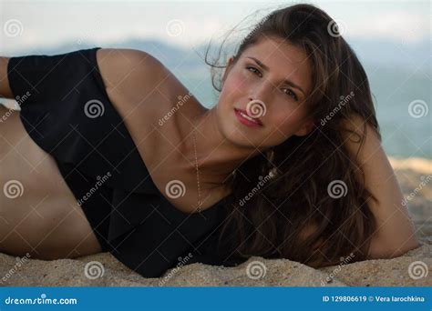 Beautiful Brunette Woman Lying And Relaxing On The Beach Stock Image Image Of Pretty Sand
