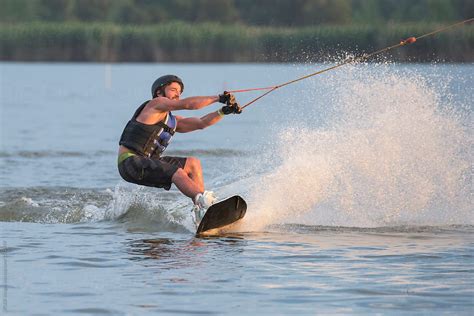 "Caucasian Man Riding Wakeboard On The Lake" by Stocksy Contributor ...