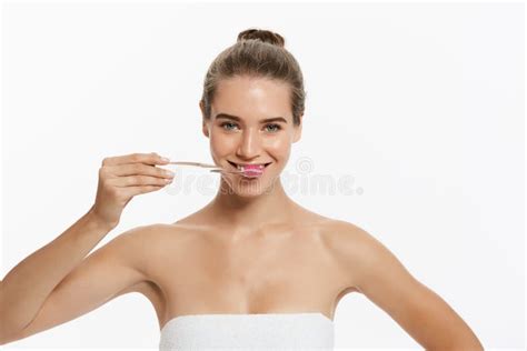 Beauty Portrait Of A Happy Beautiful Half Naked Woman Brushing Her