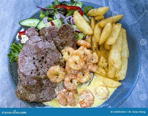 Surf And Turf Recipe Consisting Of Grilled Steak Fillets Cooked