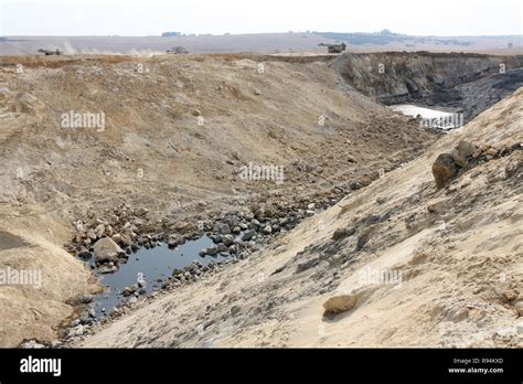 Open Pit Coal Mining Large Rock Dump Trucks And Excavators Digging