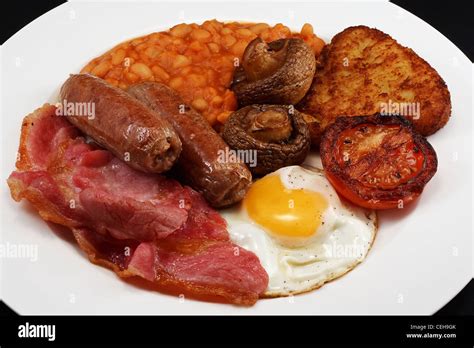 Typical Fry Up Consisting Of Sausage Bacon Egg Mushrooms Hash