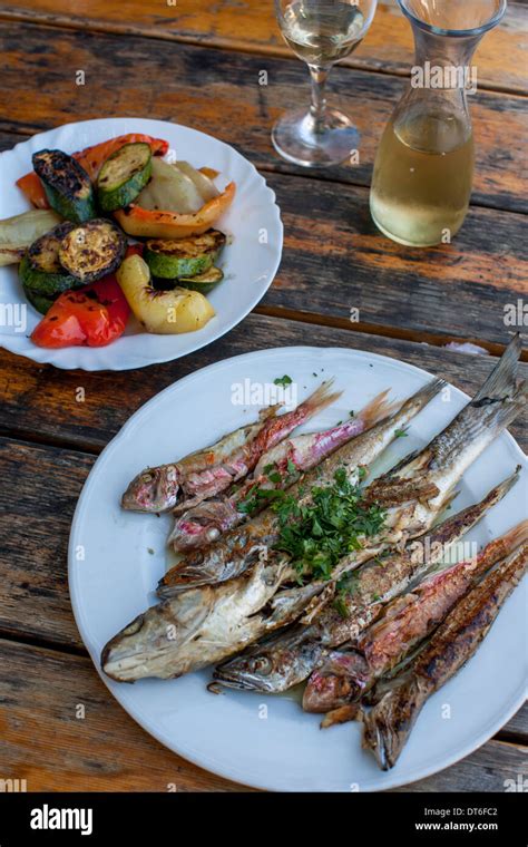 Grilled fish with grilled vegetables Stock Photo - Alamy