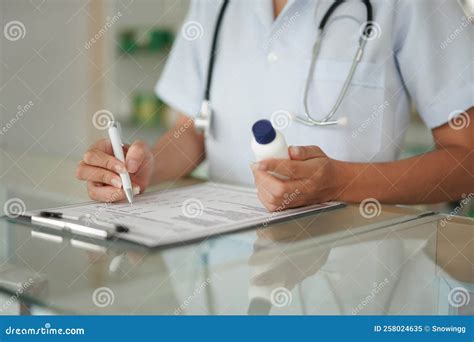 Medicine And Health Concept Female Pharmacist Hold Pill Bottle And