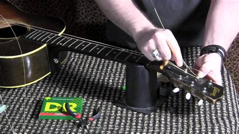 How To Change Strings On Your Acoustic Guitar And Tune With Snark Clip