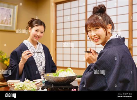 Japanese Women Having Dinner At A Hot Spring Inn Stock Photo Alamy