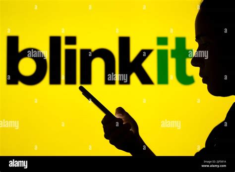 In this photo illustration, the Blinkit logo is seen in the background ...