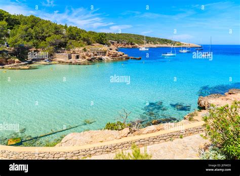 View Of Cala Portinatx Beach And Coastal Promenade Ibiza Island Spain