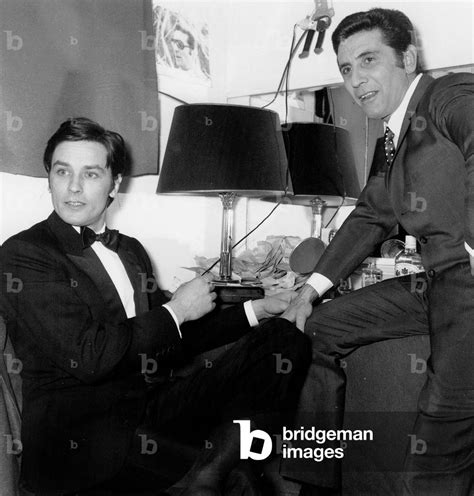 Image Of French Singer Gilbert Becaud With Actor Alain Delon In