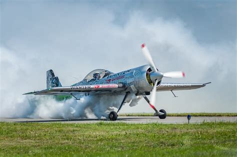 Airplane Performing at Airshow and Shows a Stunt on the Runway ...