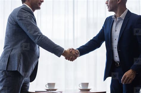 Business Men Shaking Hands With Each Other After A Deal Photo 144022