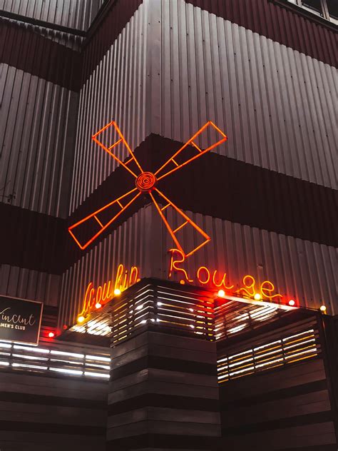 Neon Sign on a Building · Free Stock Photo