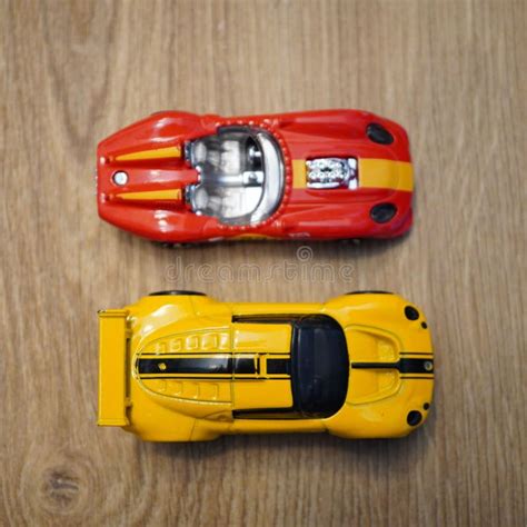 Top View Of The Lotus Sport Elise And Glory Chaser Mattel Hot Wheels Toy Cars On A Wooden