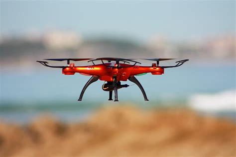 Premium Photo Quadrocopter Flying On The Beach