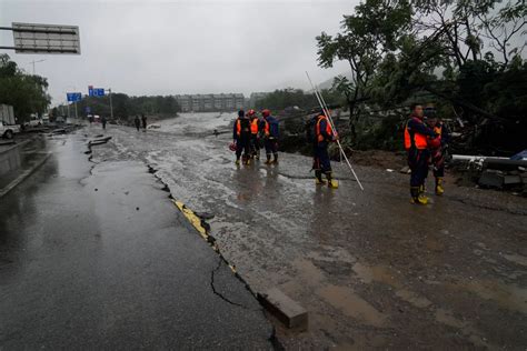 Photos Extreme Rain In Beijing After Typhoon Turns Roads Into Rivers