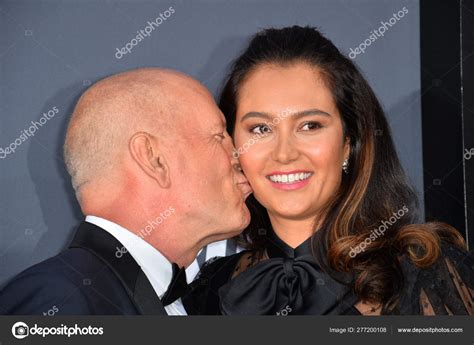 Emma Heming And Bruce Willis Kiss