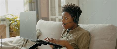 DX Portrait of African American Black kid playing online games on his ...