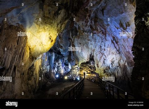 A Woman Takes A Photograph Within Paradise Cave In Phong Nha National