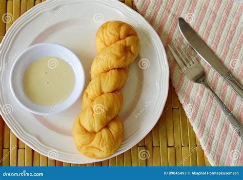 Soft Twist Bread Dipping With Sweetened Condensed Milk Stock Image Image Of Condensed Cloth