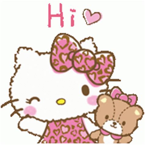 hello kitty holding a teddy bear with japanese writing
