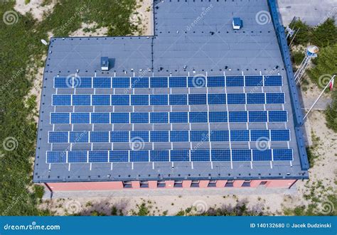 Aerial View Of Solar Panels Covering The Whole Roof Of A Building Stock