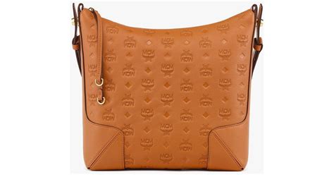 Mcm Aren Hobo In Embossed Monogram Leather In Brown Lyst