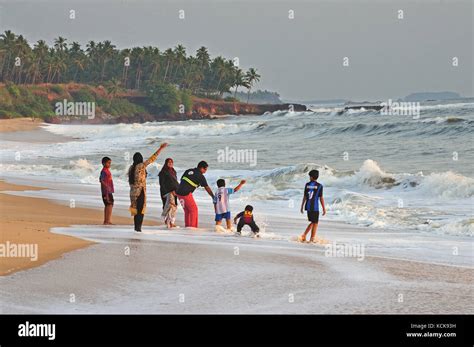 family on beach, Thottada Beach, Kerala, India Stock Photo - Alamy