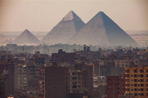 The Great Pyramids Of Giza Seen From Downtown Cairo With The Sprawling City Below Stock Photo ...