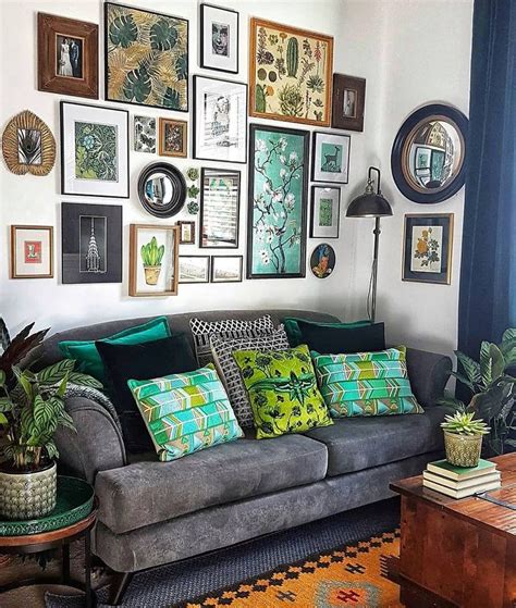 A Living Room Filled With Furniture And Lots Of Framed Pictures On The