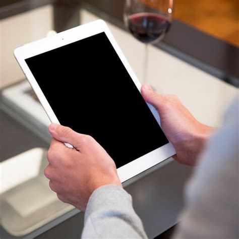 Free Photo Close Up Of A Man S Hand Holding Digital Tablet With Blank